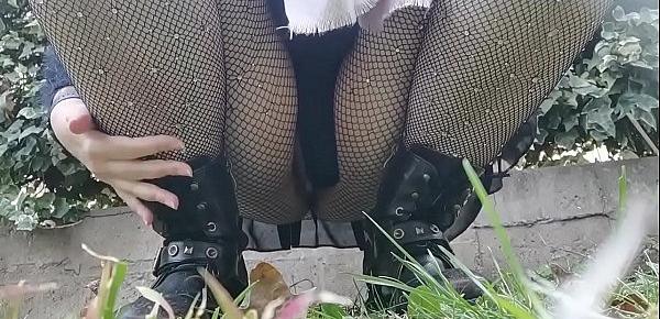  Your mother wants to piss in a public garden so she bends over and shows you her pussy under a pair of fishnet stockings